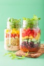 Vegan quinoa bean vegetable salad in mason jars