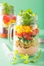 Vegan quinoa bean vegetable salad in mason jars