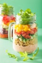 Vegan quinoa bean vegetable salad in mason jars