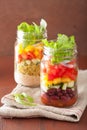 Vegan quinoa bean vegetable salad in mason jars