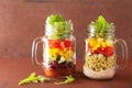 Vegan quinoa bean vegetable salad in mason jars