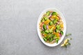 Vegan quinoa and broccoli warm salad with oranges and fresh onion Royalty Free Stock Photo