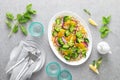 Vegan quinoa and broccoli warm salad with oranges and fresh onion Royalty Free Stock Photo