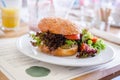 Vegan quinoa burger in a restaurant