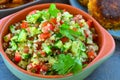 Vegan quinoa salad served in earthen bowl Royalty Free Stock Photo