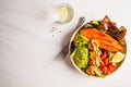 Vegan Rainbow bowl: vegetable meatballs, avocado, sweet potato a