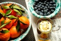 Vegan , raw breakfast with green tea, mandarins and blueberries