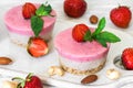 Vegan raw strawberry cheesecake with fresh berries, mint and nuts. healthy vegan food