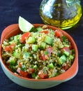 Mediterranean vegan salad with olive oil in background