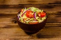 Vegan salad with savoy cabbage, tomatoes and onion in a ceramic bowl Royalty Free Stock Photo