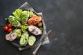 Vegan sandwiches with vegetables, radish, tomato, rye bread on black. Appetizer for party Royalty Free Stock Photo