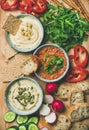 Vegan snack board. Flat-lay of Vegetarian dips hummus, babaganush, muhammara