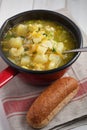 Vegan soup with potato, celery, carrot, rice, and green onion