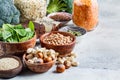 Vegan sources of protein, background. Tofu, chickpeas, lentils, nuts, spinach and broccoli - vegetable proteins