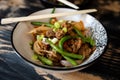 Vegan stir fry with chopsticks Royalty Free Stock Photo