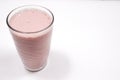 Vegan Strawberry Banana smoothie in a glass, on a white background Royalty Free Stock Photo