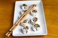 vegan sushi roll with soy sauce and chop sticks Royalty Free Stock Photo