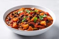 Vegan Sweet Potato And Black Bean Chili On White Round Plate On White Background. Generative AI