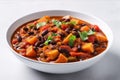 Vegan Sweet Potato And Black Bean Chili On White Round Plate On White Background. Generative AI Royalty Free Stock Photo