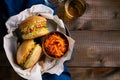 Vegan sweet potato chickpea burgers with avocado guacamole sauce and carrot slaw