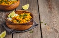 Vegan Sweet Potato Chickpea curry in wooden bowl on a wooden background. Healthy vegetarian food concept. Royalty Free Stock Photo