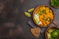 Vegan Sweet Potato Chickpea curry in wooden bowl on a dark background, top view. Healthy vegetarian food concept. Royalty Free Stock Photo