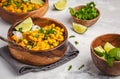 Vegan Sweet Potato Chickpea curry in wooden bowl on light background. Healthy vegetarian food concept. Royalty Free Stock Photo