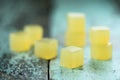 Vegan sweets. Homemade agar jelly cubes on shabby rustic background