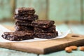 Vegan sweets. Pile of homemade vegan brownies on wooden board Royalty Free Stock Photo