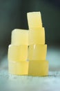 Vegan sweets. Stack of homemade agar fruit jelly cubes on rustic
