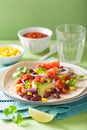 Vegan taco with vegetable, kidney beans and salsa