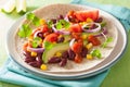 Vegan taco with vegetable, kidney beans and salsa