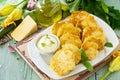 Vegan vegetable fritters zucchini and sour cream garlic sauce on the kitchen wooden table. Royalty Free Stock Photo