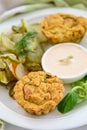 Vegan vegetable muffins with light chili-mayo dip and cucumber pickle salad