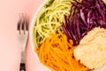 Vegan or Vegetarian Salad Bowl With Red Cabbage Courgettes Carrots And Hummus Royalty Free Stock Photo