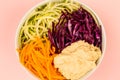 Vegan or Vegetarian Salad Bowl With Red Cabbage Courgettes Carrots And Hummus Royalty Free Stock Photo