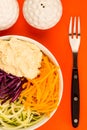 Vegan or Vegetarian Salad Bowl With Red Cabbage Courgettes Carrots And Hummus Royalty Free Stock Photo