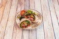 vegan wrap stuffed with cooked red beans, ripe avocado and lettuce with crushed tomato with lettuce Royalty Free Stock Photo