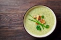 Vegaterian winter split pea turmeric soup on dark wooden background, close-up, top view Royalty Free Stock Photo