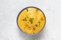 Vegetarian red lentil creamy soup in bowl on gray stone background, top view, close up Royalty Free Stock Photo
