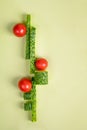 Vegetable art composition. Abstract balancing construction of sliced cucumber and tomatoes. Royalty Free Stock Photo