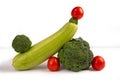 Vegetable art composition. Abstract balancing design of zucchini, broccoli and tomatoes. Copy space. Royalty Free Stock Photo