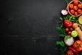 Vegetable background. Fresh tomatoes, paprika, onions and parsley on the table. Royalty Free Stock Photo