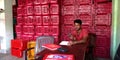 A vegetable basket vendors seating into store room