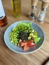 Vegetable bowl on the table in a gray round plate