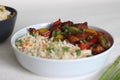 Vegetable Carrot Fried Rice with Indian spices served along with chilly chicken Royalty Free Stock Photo