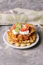 Vegetable and cheese savory waffles with tomatoes and herbs