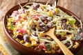 Vegetable coleslaw salad with beans, corn, pepper and herbs closeup in a plate. horizontal Royalty Free Stock Photo