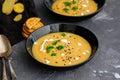 Vegetable cream soup with basil, black sesame and cheese biscuits. Royalty Free Stock Photo