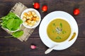 Vegetable cream soup with spinach and potatoes in a white bowl with garlic croutons Royalty Free Stock Photo